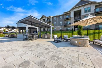 Outdoor Bar and Grill Area with Fire Pit  at The Prairie Villas, Dardenne Prairie, MO 63368